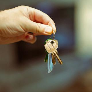 Hand holding a set of house keys