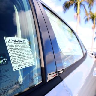 Proposition 65 warning notice in vehicle window
